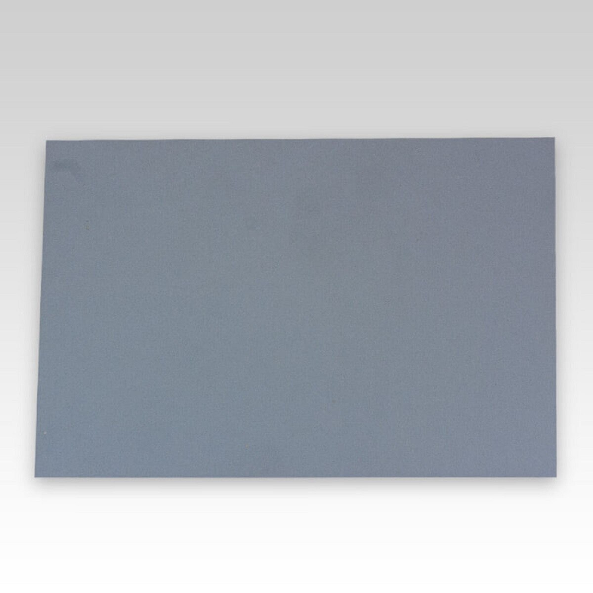 Image of print making linoleum mounted to particleboard
